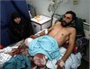 img_5296811527_gaza_man_wounded_wife_aljazeera.jpg